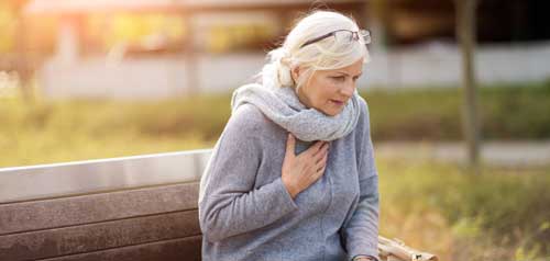 A woman experiencing chest pains