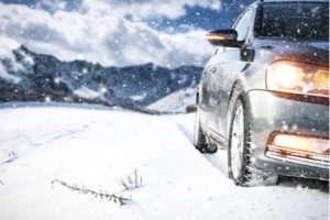 A car driving in snow, winter accident concept image